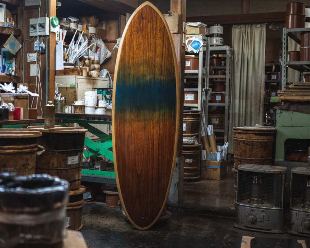 Siita wooden surfboard standing in the workshop