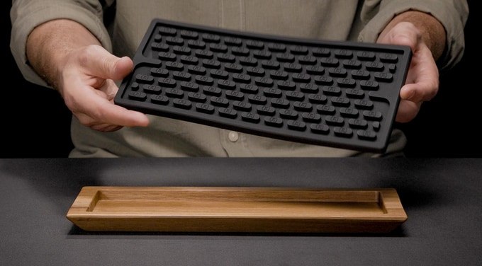 Removable silicone bar mat lifted from its acacia frame