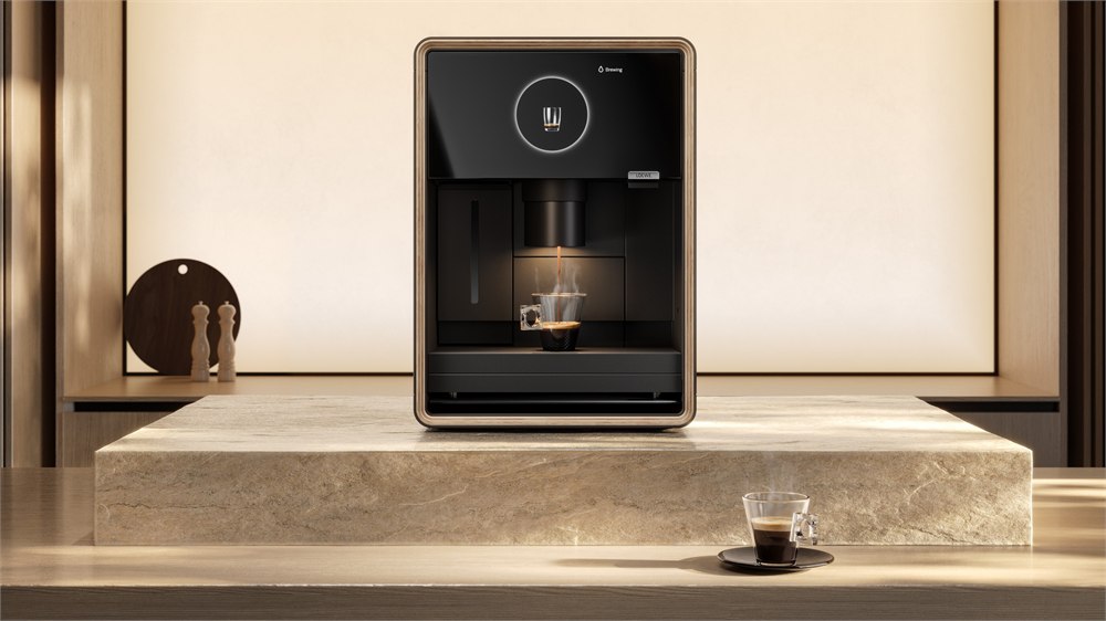 Front view of the aura.matic dispensing coffee in a stone kitchen setting
