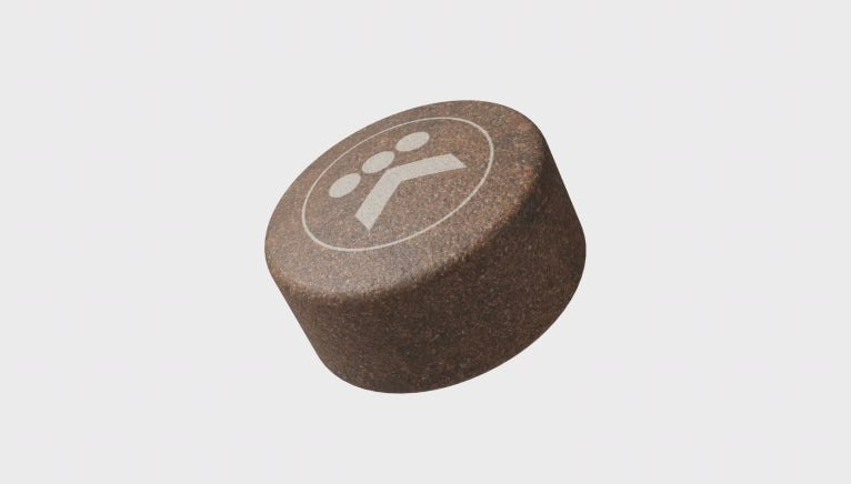 An AltaRound made from pressed ground coffee