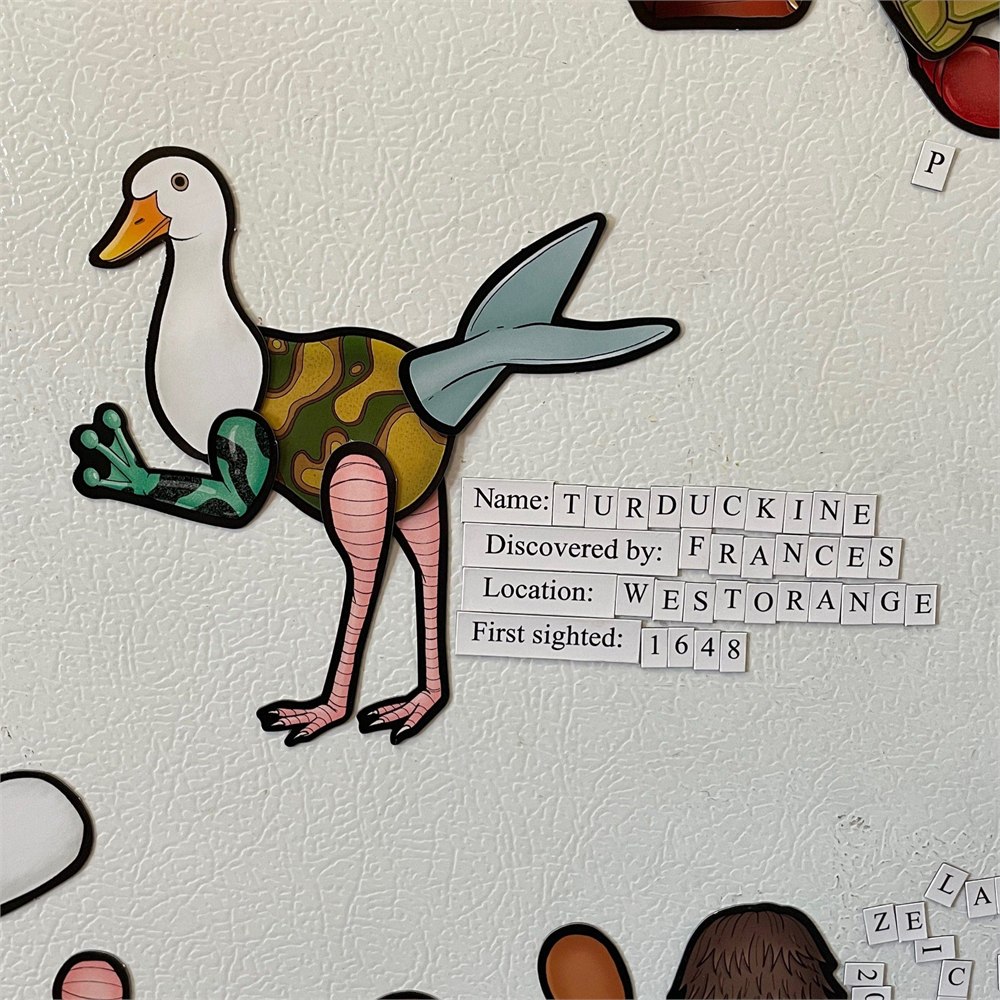 Duck-headed magnetic creature with a discovery label