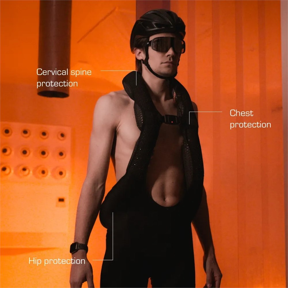 Cyclist wearing the Aerobag system with its intended coverage areas illustrated
