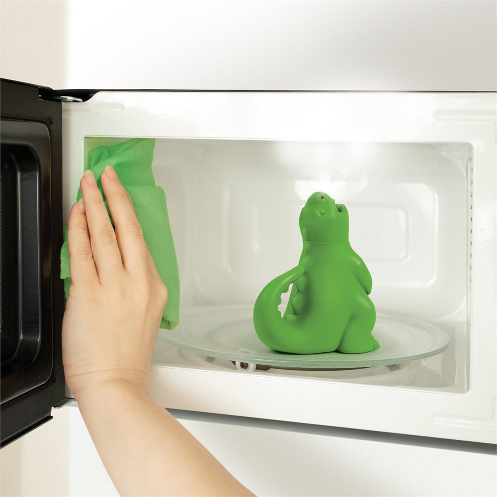 Dragon cleaner inside a microwave during wiping