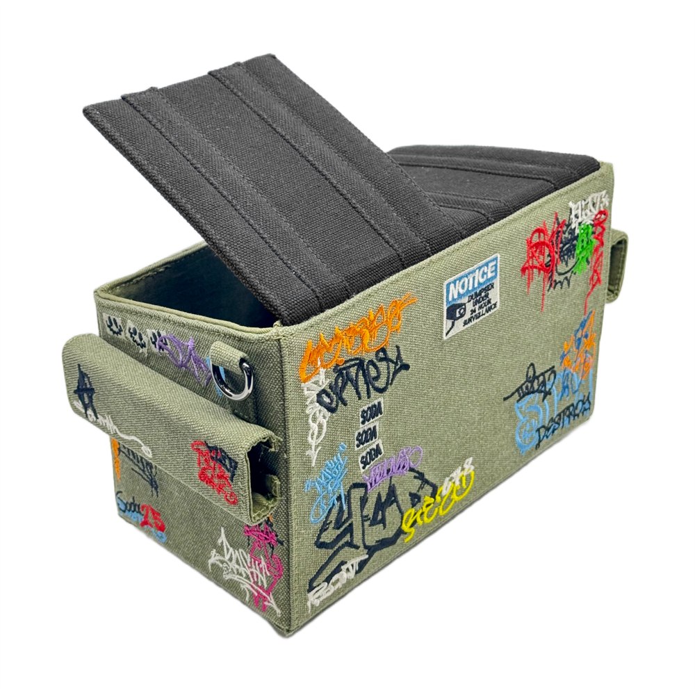 Rear view of dumpster bag showing strap ring and embroidered details