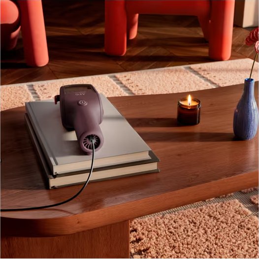 ErgoMini charging through USB-C on a coffee table
