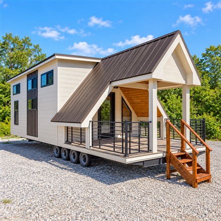This Extra-Wide Tiny Home Fits a Covered Porch, Downstairs Bedroom, and Bonus Room