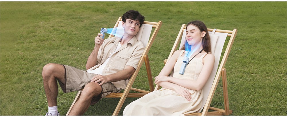 Personal fans used beside outdoor camping chairs