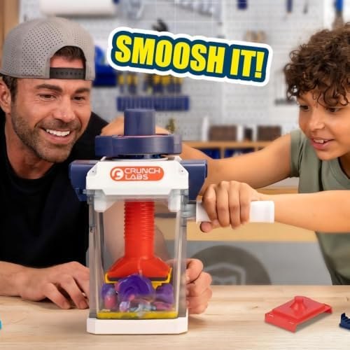 Mark Rober and a child watching an object squish inside the toy chamber