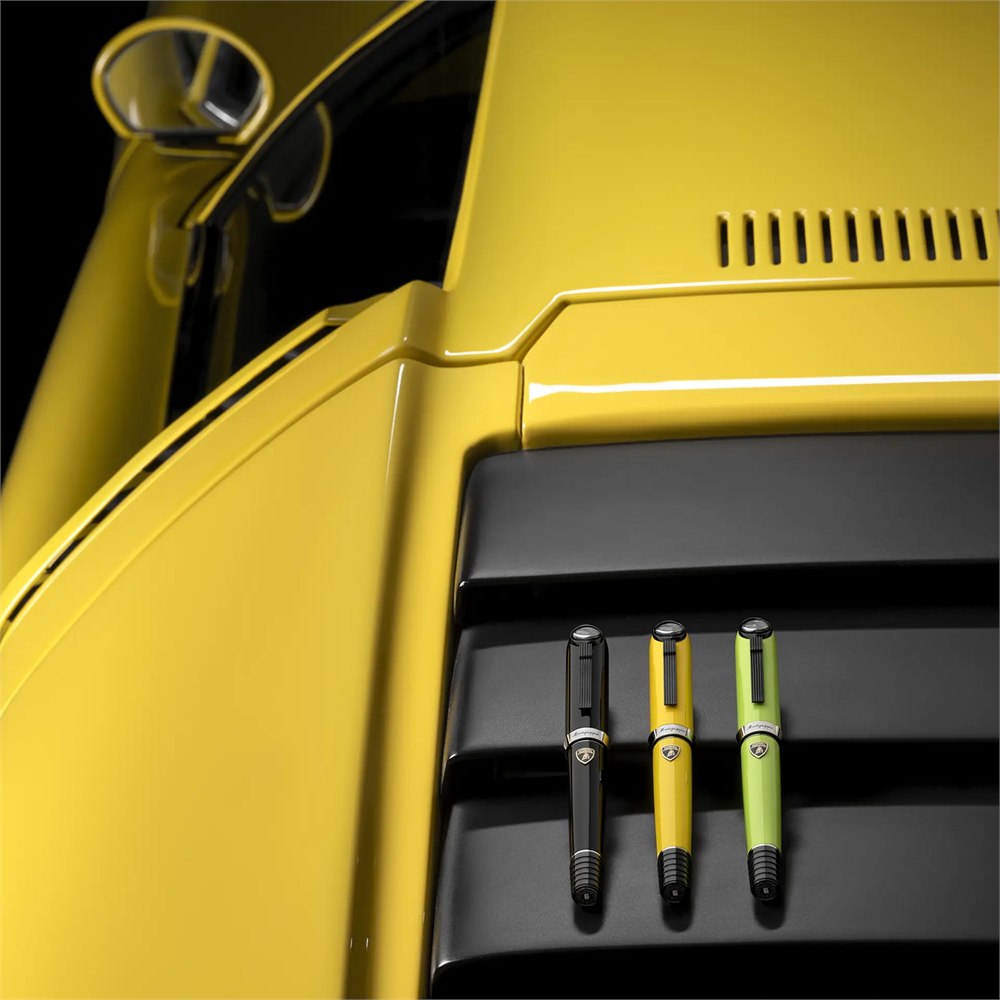 Three pen colors beside a yellow Miura engine grille
