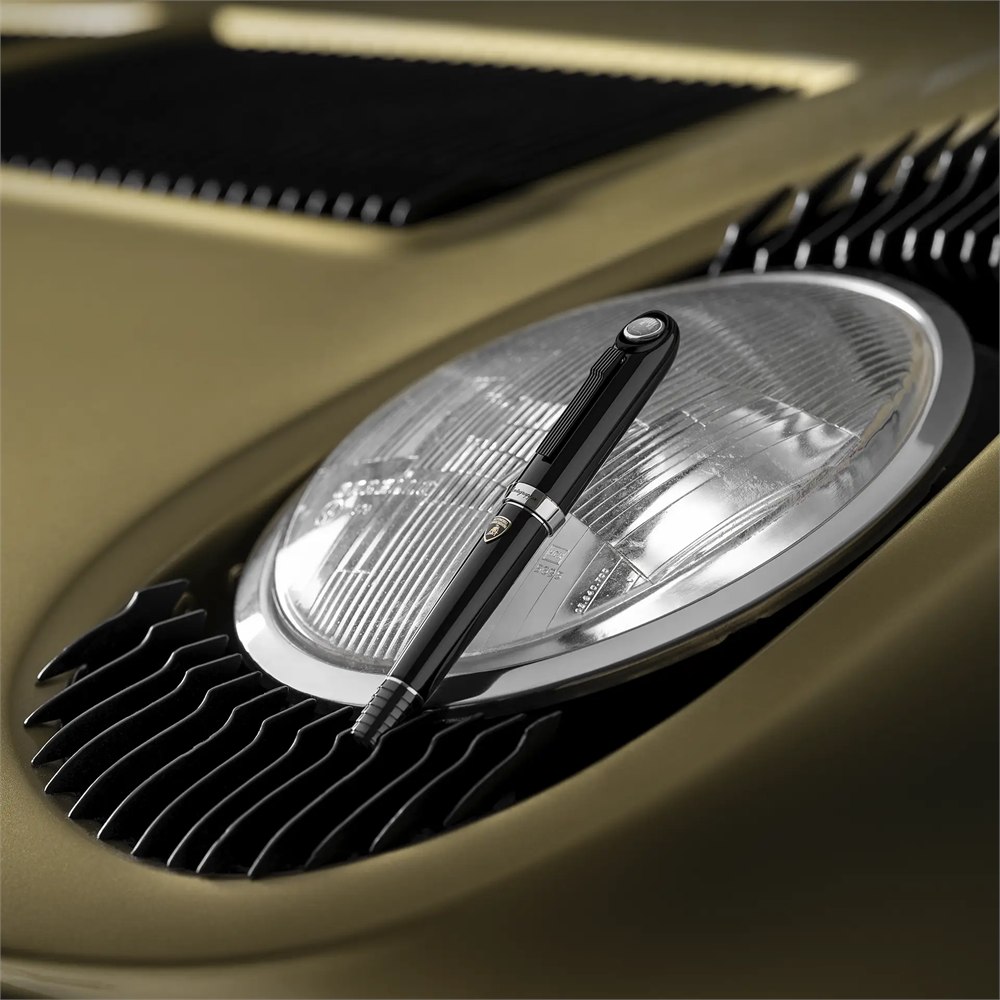 Black capped pen on a Miura headlight