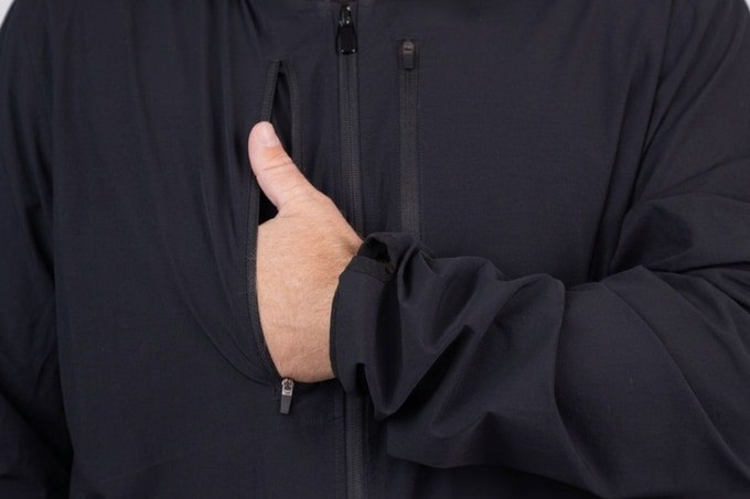 Close-up of a hand entering the upper arm-support pocket