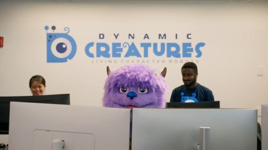 Hugo behind office monitors at Dynamic Creatures