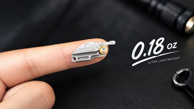 Folded G11 resting on one fingertip