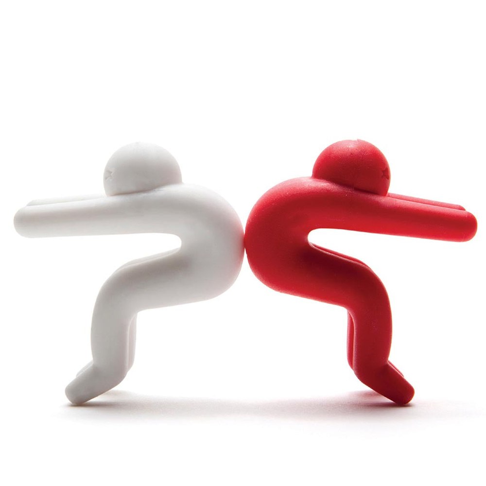 Two Lid Sid figures viewed from the side with long arms and bent legs