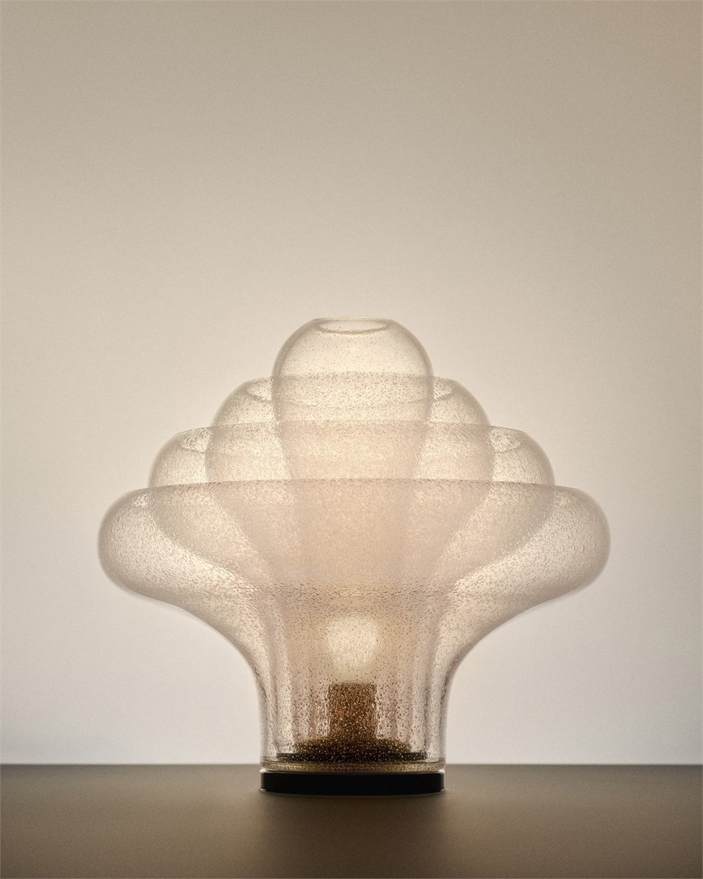 Illuminated Lotus table lamp on a dark surface