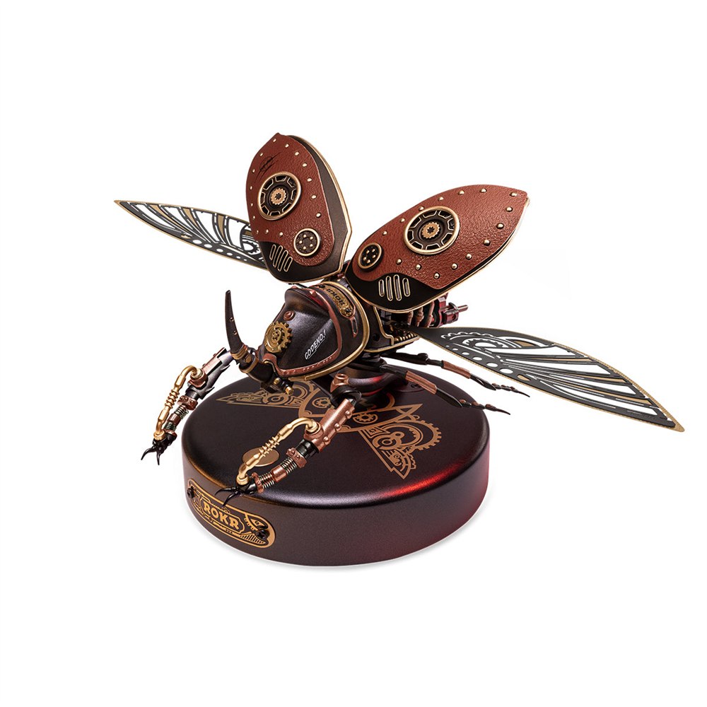 Mechanical rhinoceros beetle with spread metal wings on its display base