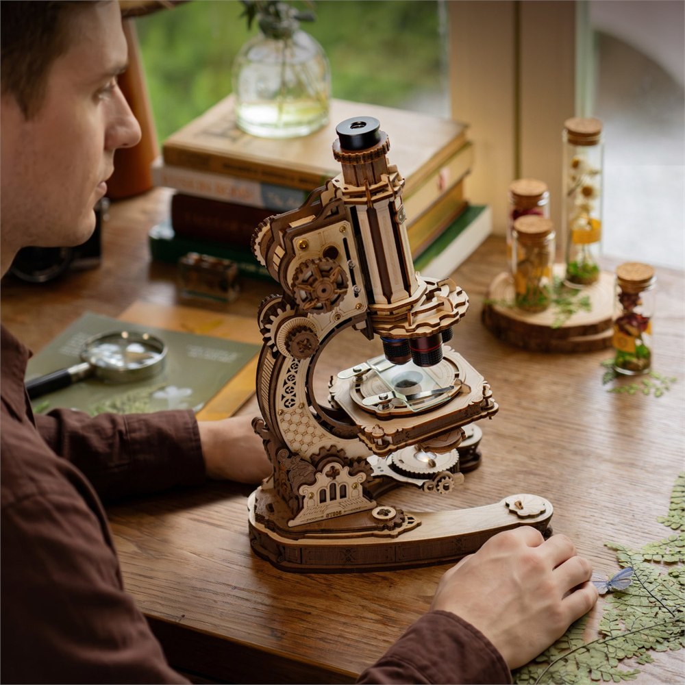 Wooden microscope displayed on a study desk