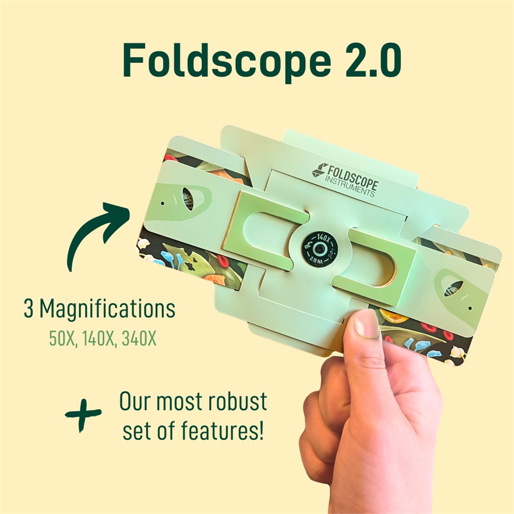 Foldscope 2.0 folded pocket microscope held in one hand