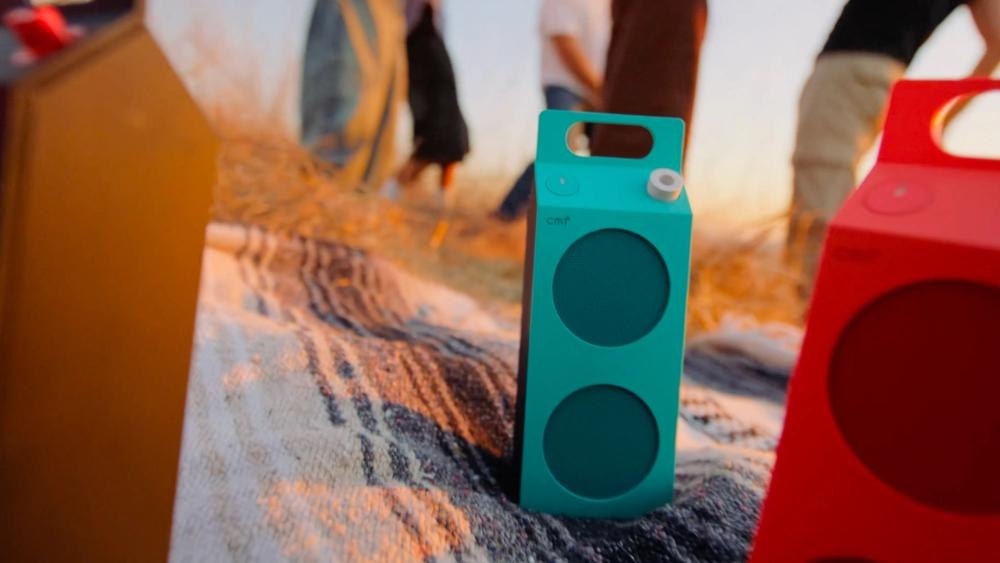 Turquoise Speaker M pictured in an outdoor listening setup