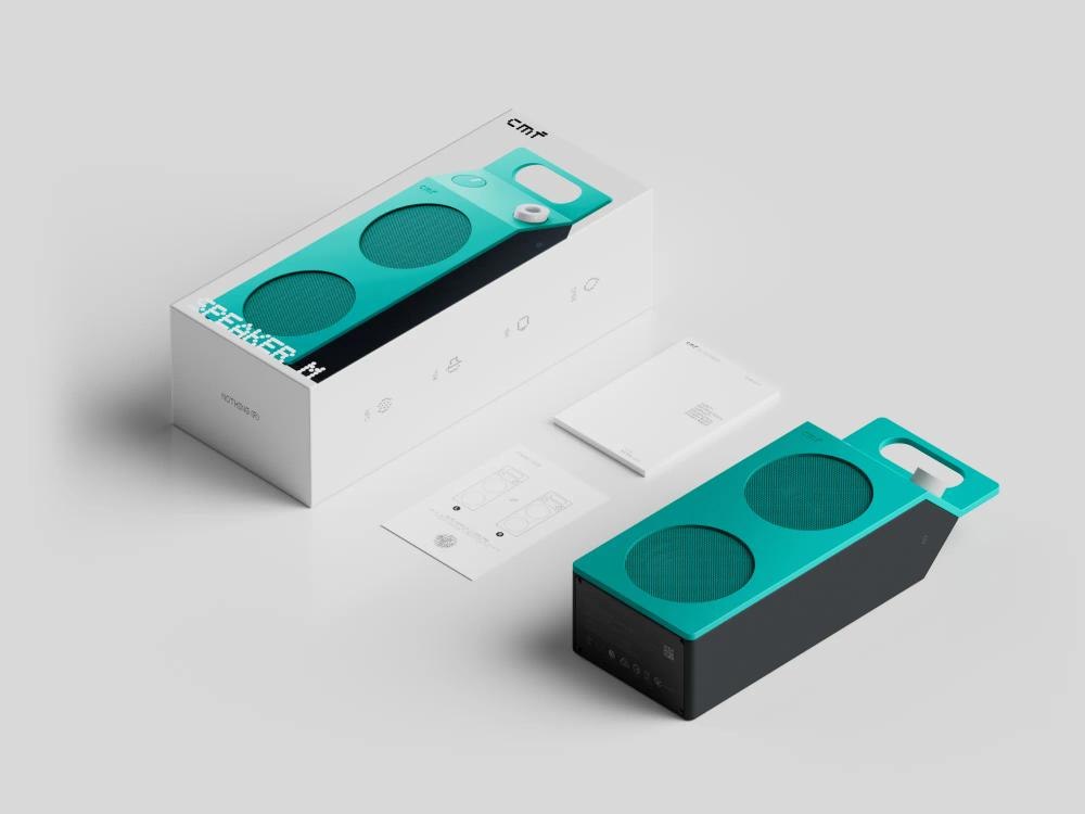 Turquoise Speaker M beside its retail box and documentation