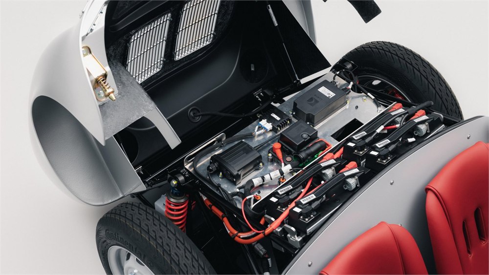 Porsche 550 J with rear bodywork open to reveal its electric drivetrain and chassis
