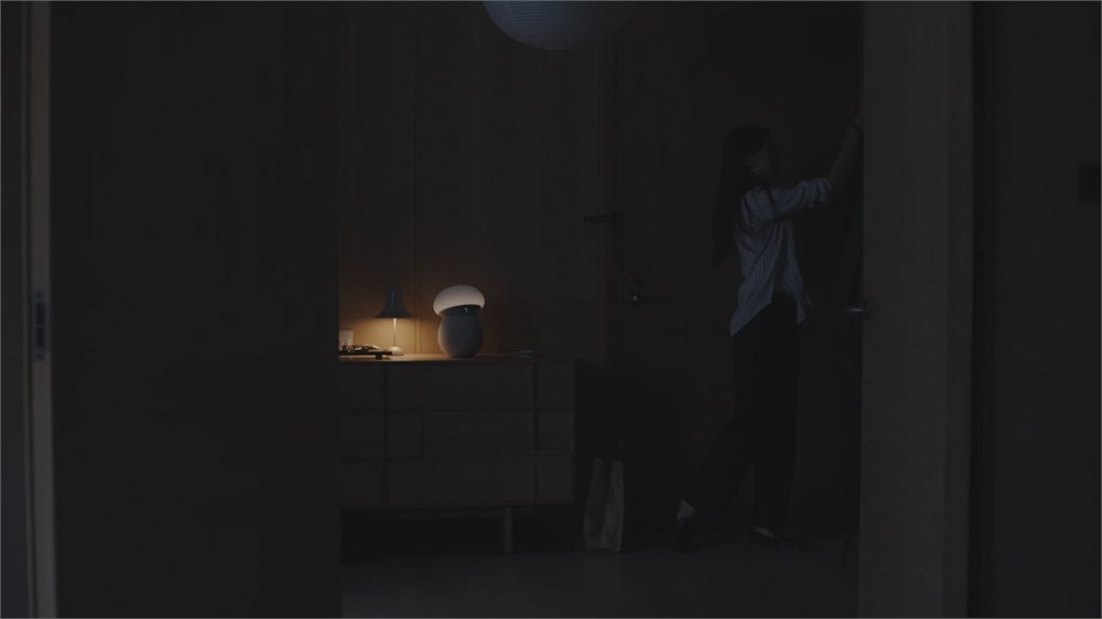 Mori glowing on a table during a homecoming scene