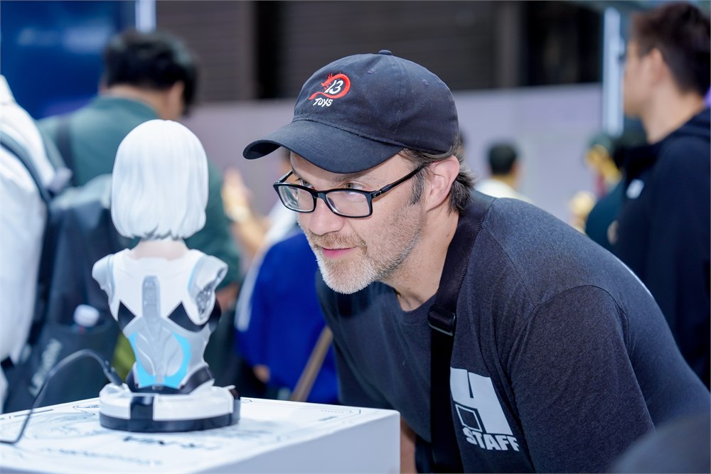 Visitor interacting with FR-NIA at a product demonstration