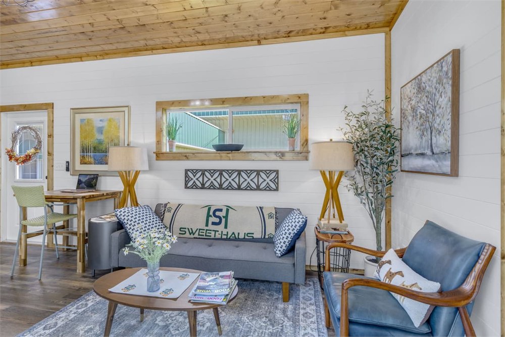 Nordic Nook living room with sofa and wood ceiling