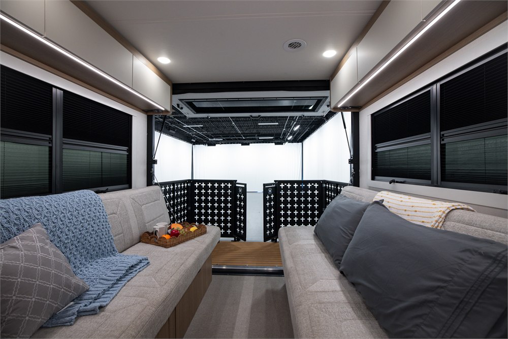 Rear lounge opening toward the motorhome deck