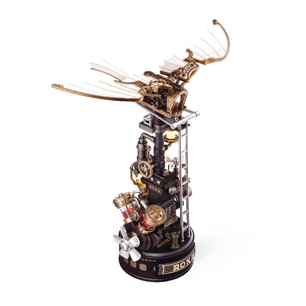 Complete ornithopter model with pale wings above an industrial tower
