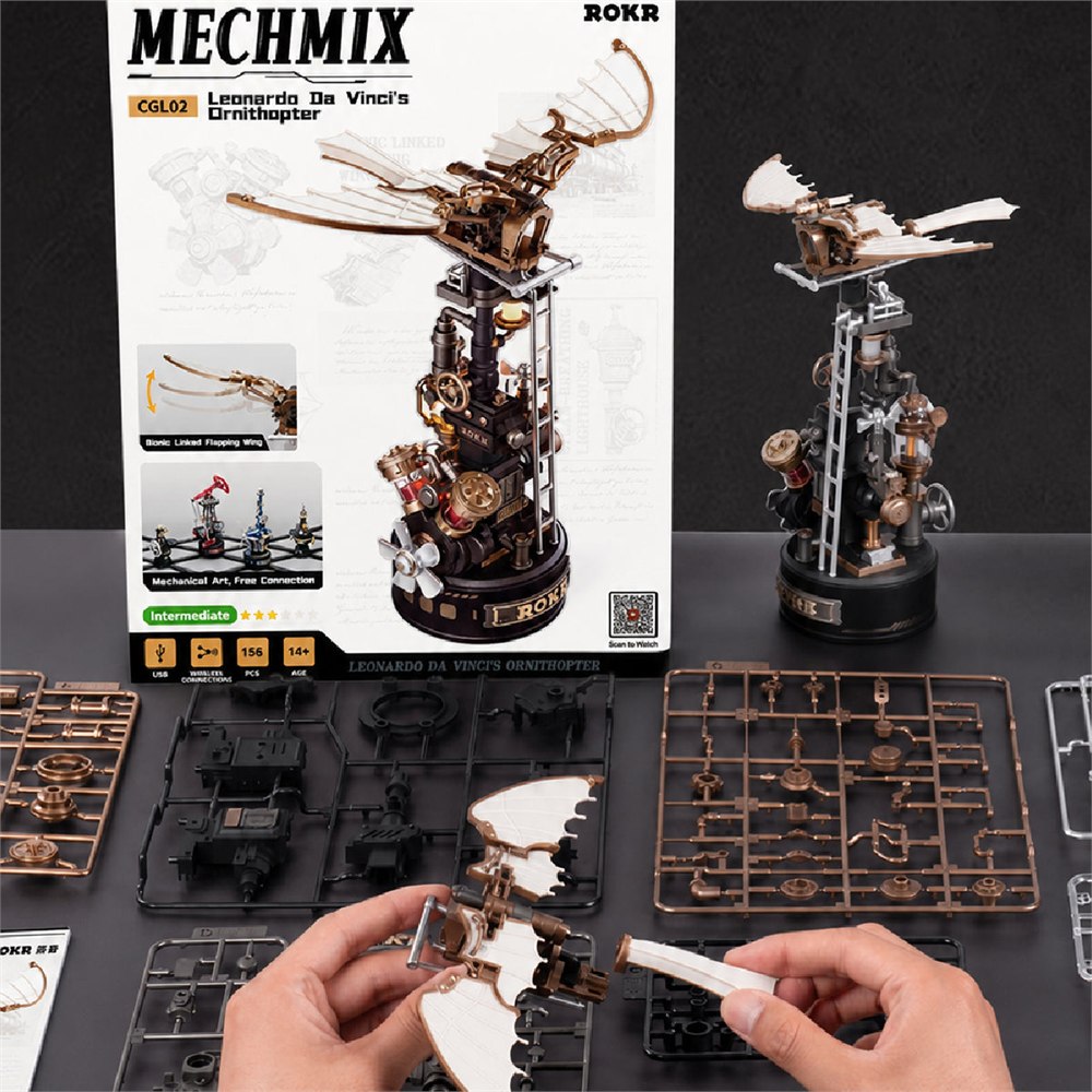 Model kit components and hands assembling the ornithopter