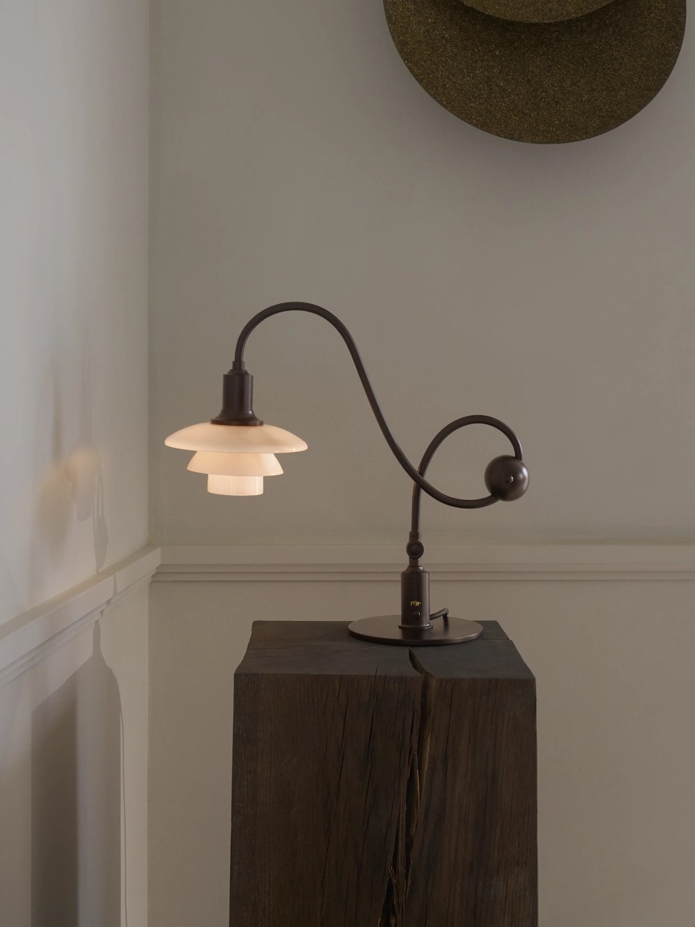 Glowing piano table lamp on a wooden pedestal