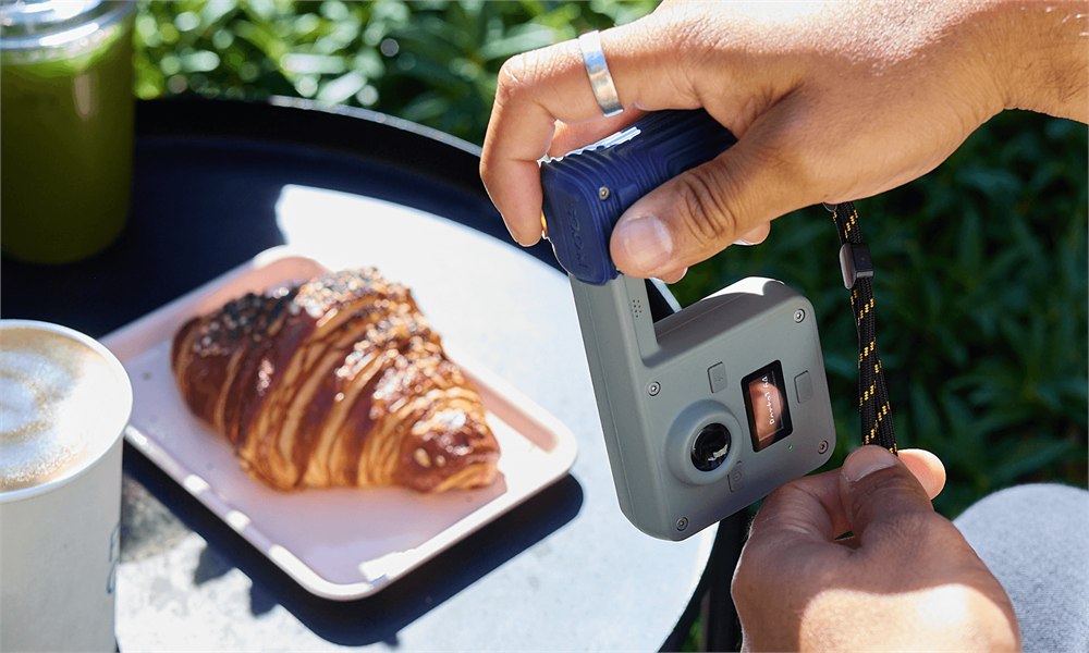 Portal camera being used to photograph a pastry outdoors