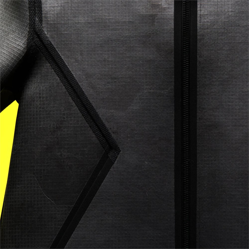 Detail of the slate tile surface, black zip and angular pocket outline