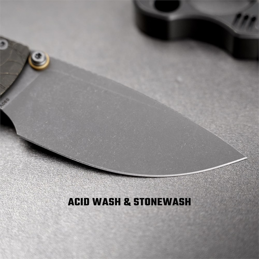 Close-up of the gray acid-washed and stonewashed S90V blade
