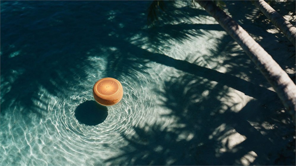 Mango official visualization of the amber speaker floating face-up