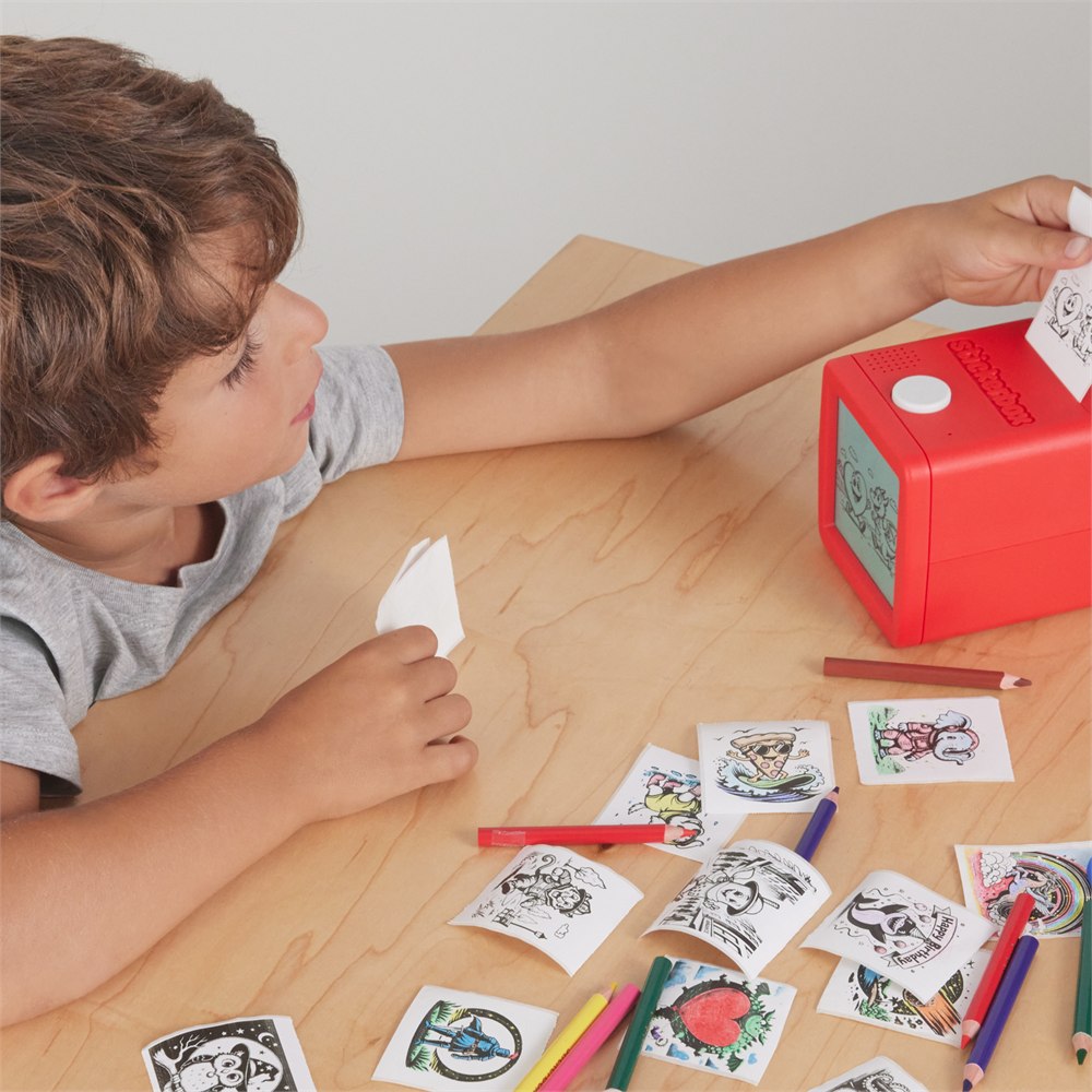Child collecting a fresh print from Stickerbox