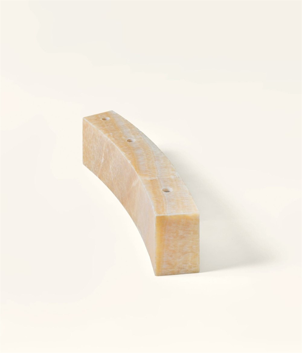 Three candle sockets in curved Honey Onyx stone