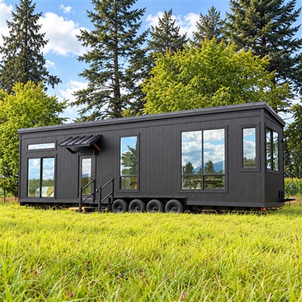 This Tiny House Pairs a 12-Foot Living Room With a Downstairs Bedroom