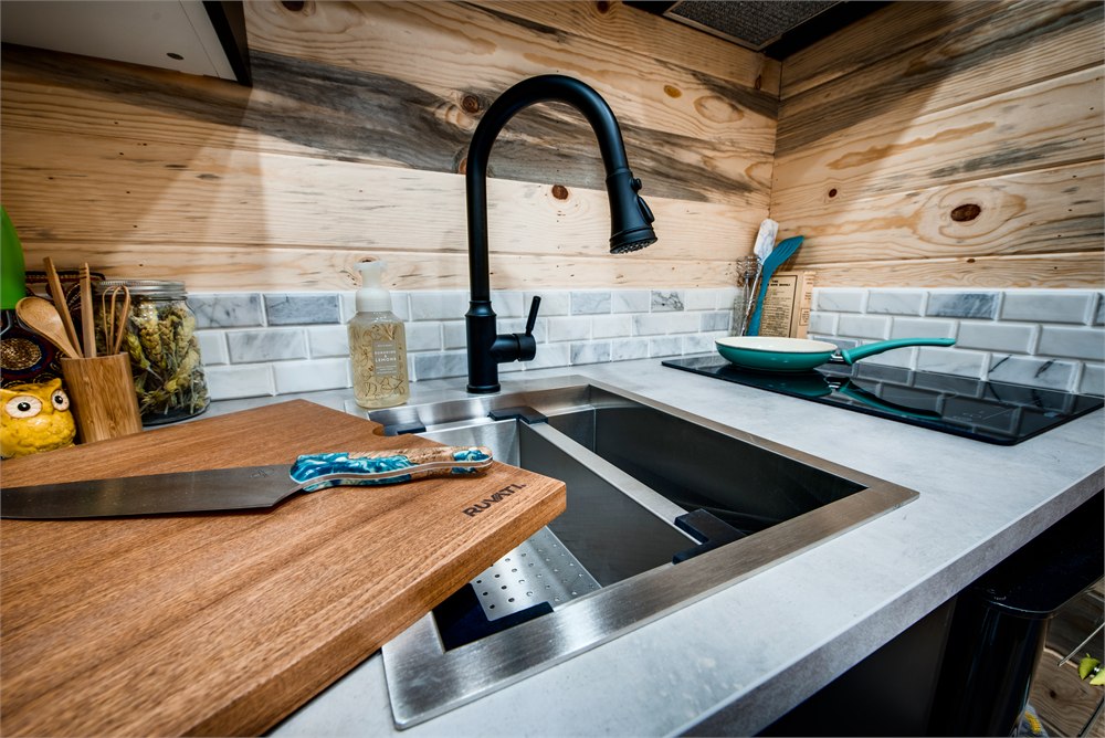 Close-up of the workstation sink and kitchen faucet