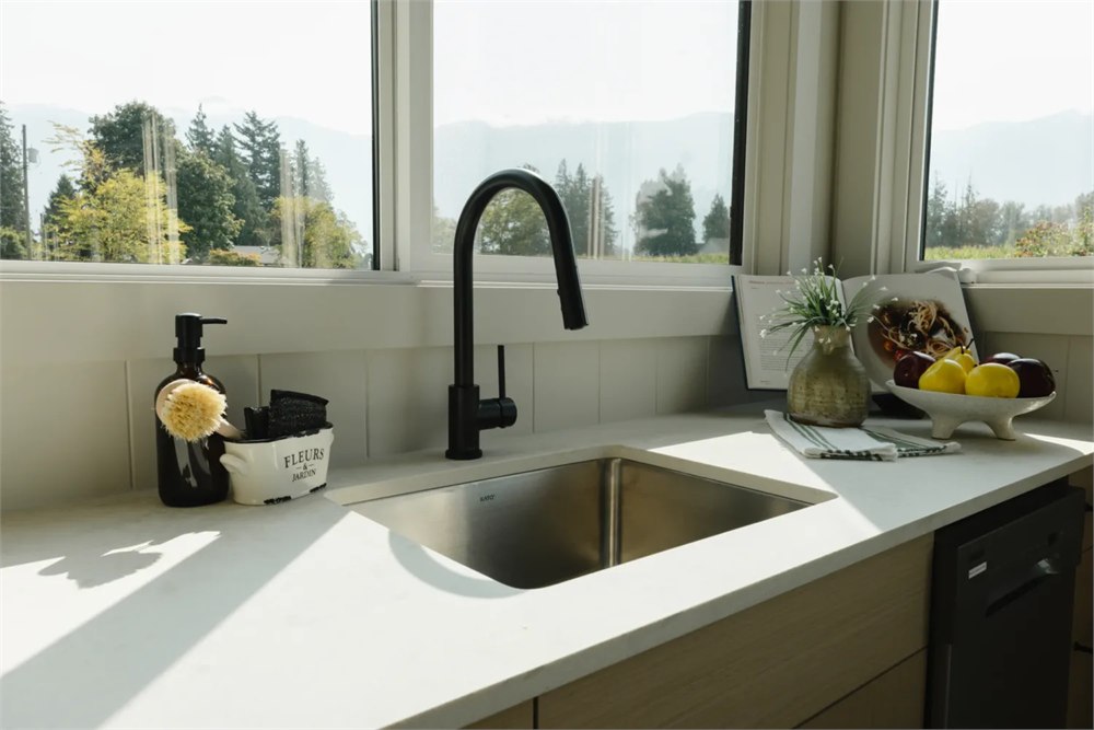 Ventura kitchen sink beside large corner windows