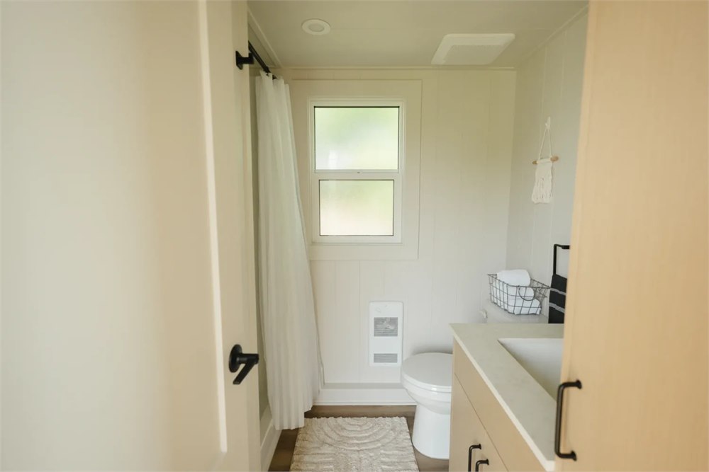 Ventura bathroom with shower, flush toilet and compact vanity