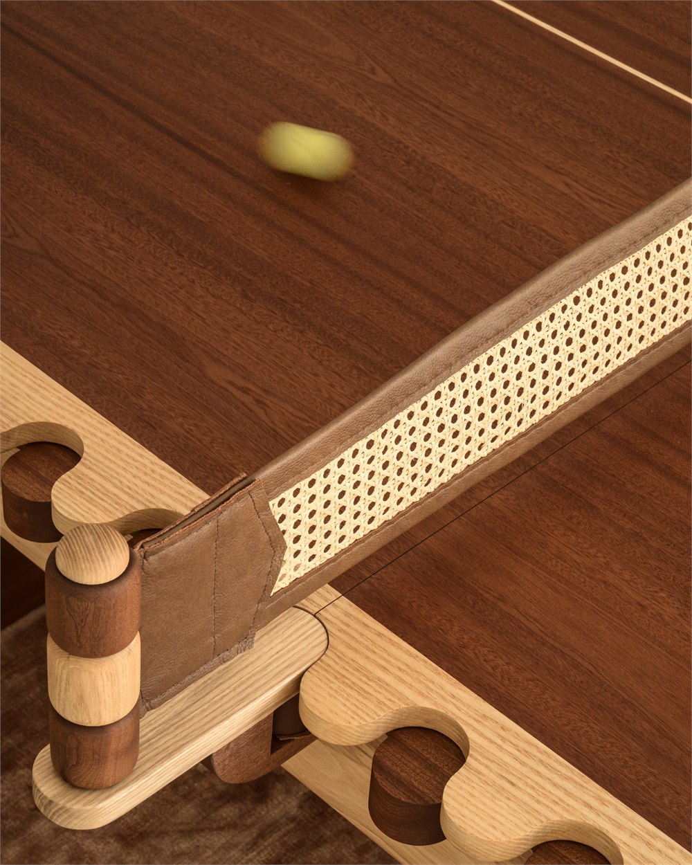 Woven table tennis net held by wooden supports