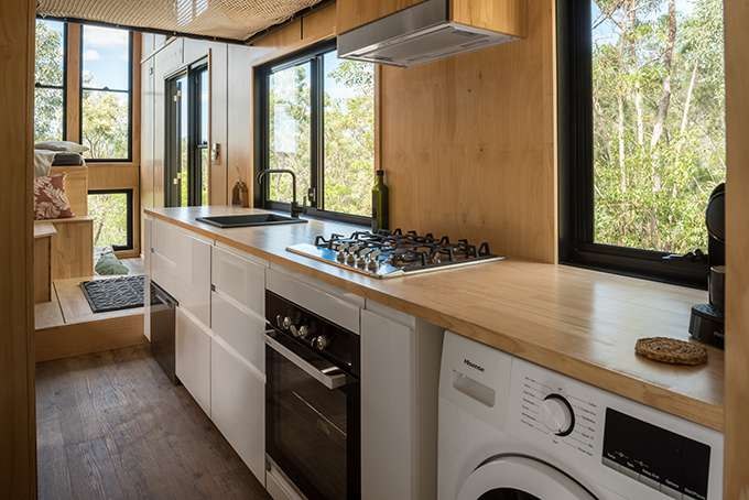Wildscape tiny house kitchen with oven and cooktop