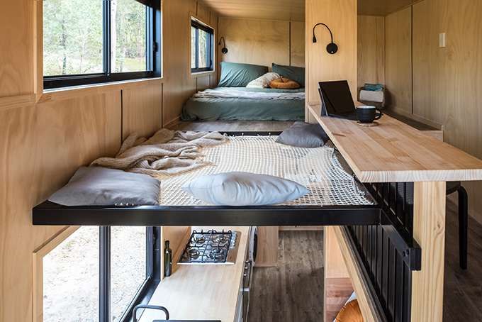 Wildscape loft bedroom with timber finishes