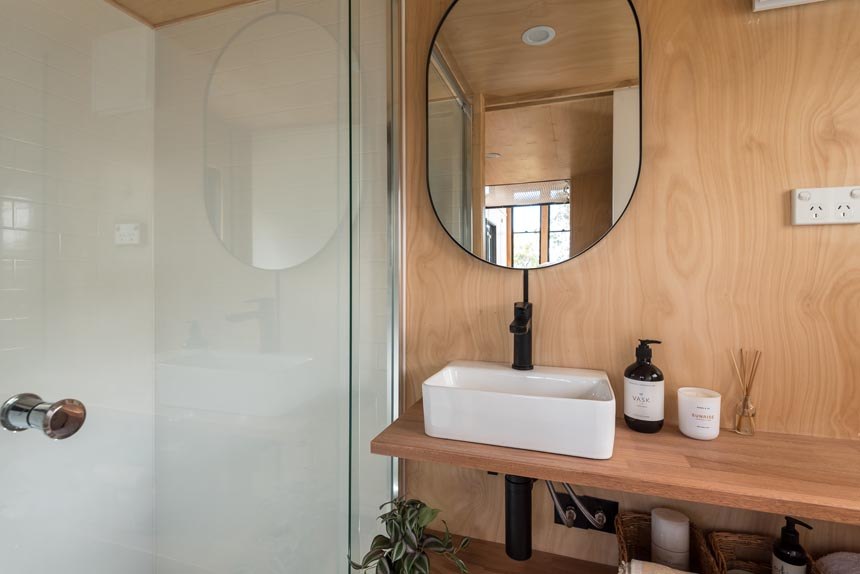 Wildscape ensuite bathroom with glass shower enclosure